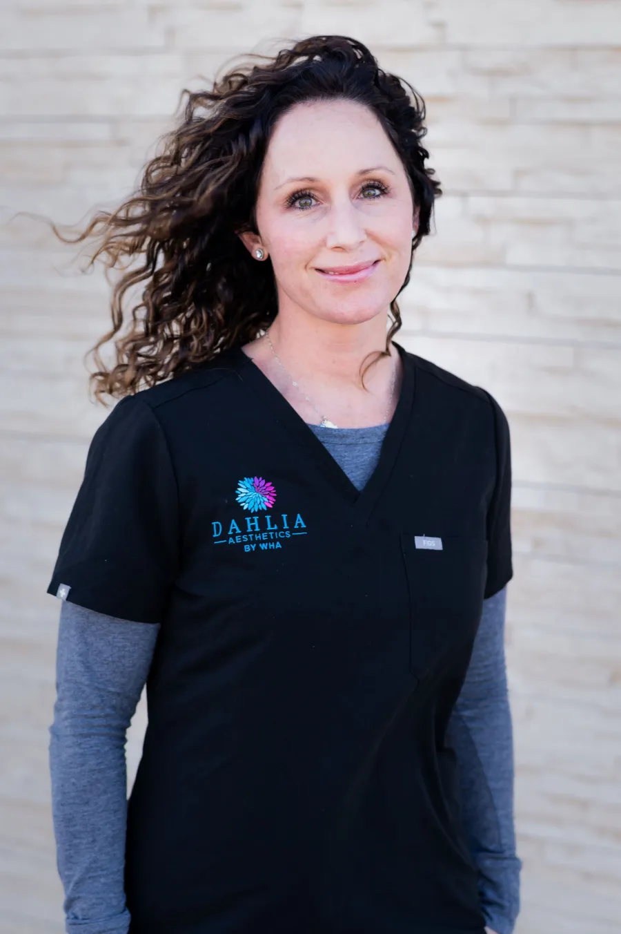 Jamie Gallagher, PAC, in black Dahlia scrubs